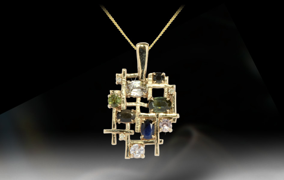 Luxury solid gold pendant with organic shape and texture set with diamonds and colourful gems