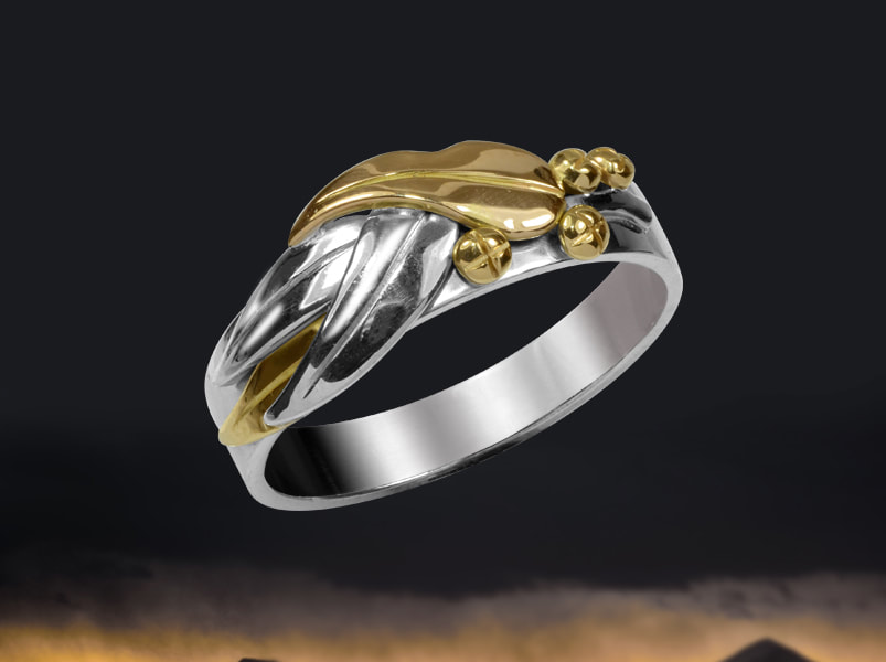Solid two tone gold ring with gum leaf motif  