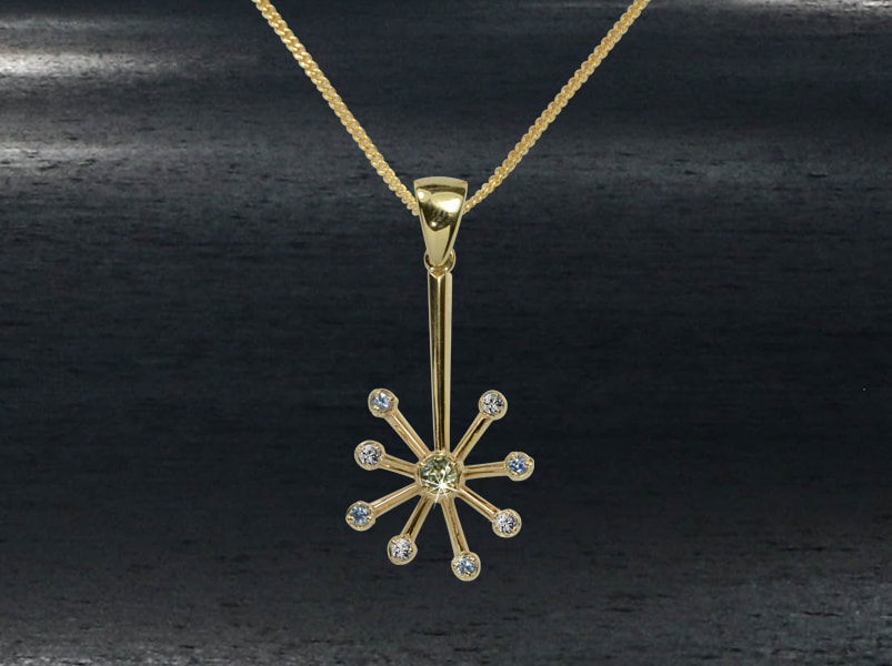 Snow flake inspired pendant in solid gold with sparkling diamonds