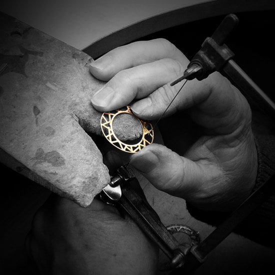 Hand sawing of delicate solid gold watch parts